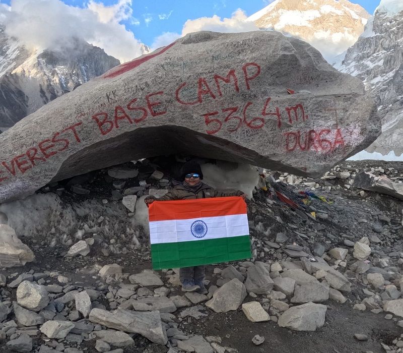 Prisha Lokesh Nikajoo holding the Indian flag at the Mount Everest base camp