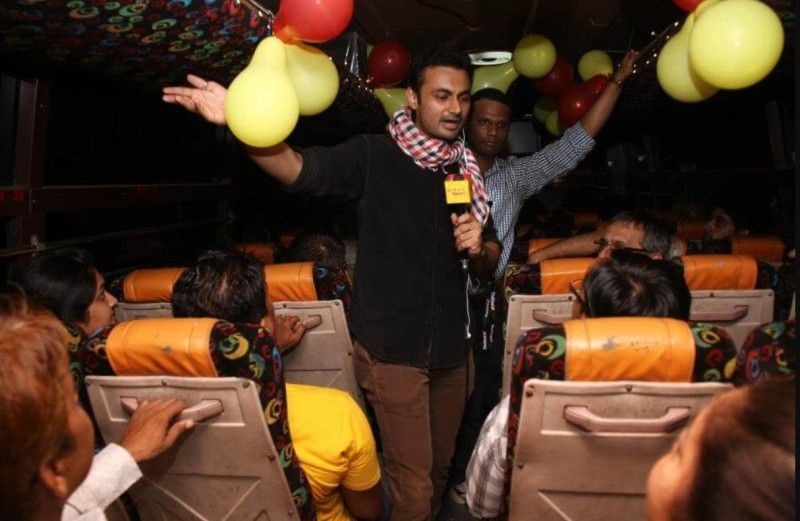 RJ Anmol hosting a radio show from a bus