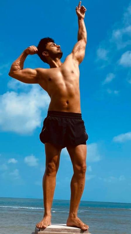 RJ Anmol posing during a workout