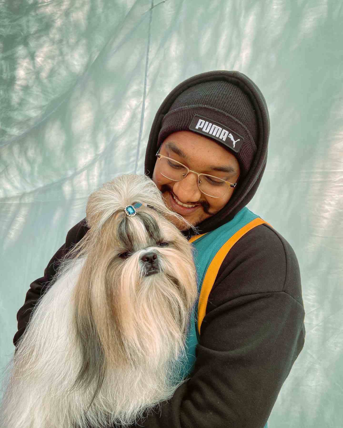 Riar Saab playing with a dog