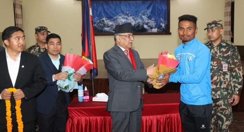 Rohit Paudel (in blue) honoured by Bardghat municipality