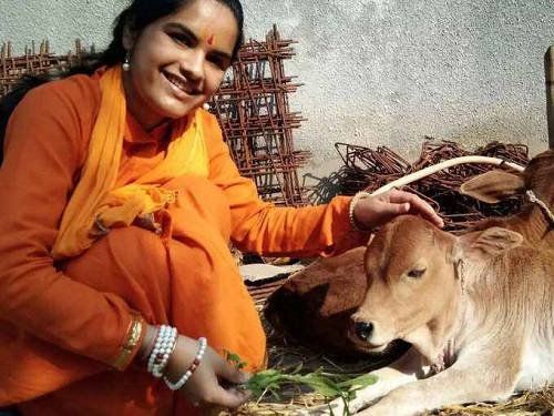Shivranjani Tiwari with a cow
