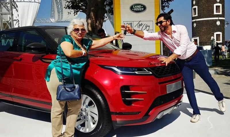 Siddhant Karnick, along with his mother, after buying a Range Rover Evoque car