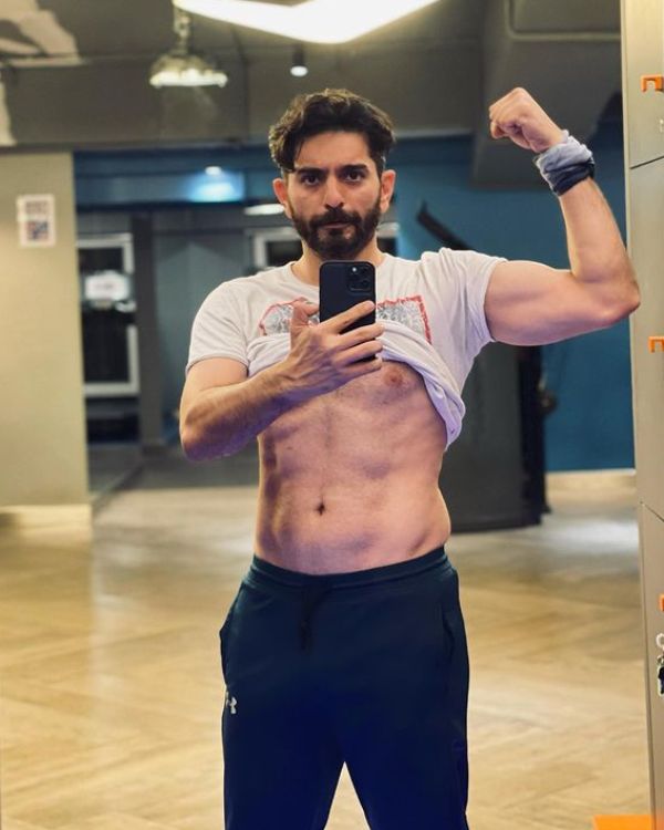 Siddhant Karnick while flexing his muscles at the gym