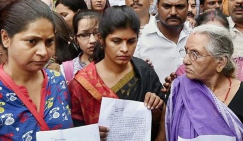 Swati Singh (centre) and her mother-in-law, Tetra Singh (on right) after filing a complaint against BSP leaders