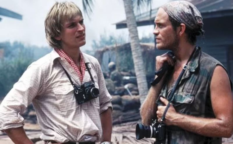 A picture of the actors of The Killing Fields (1984) Julian Sands (who portrayed Jon Swain) and John Malkovich (who portrayed Al Rockoff)