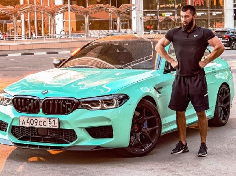 Vladimir Shmondenko posing with his BMW M5