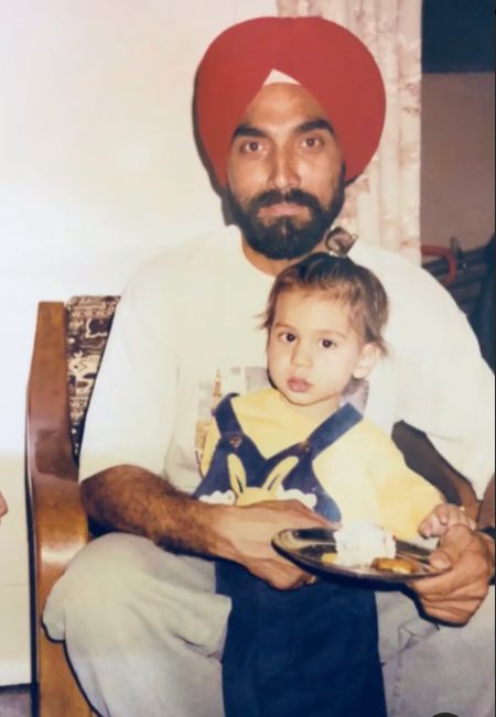 A childhood photo of Ramandeep Singh with his father
