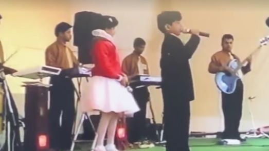 A childhood photograph of Palash Muchhal and his sister performing at a function