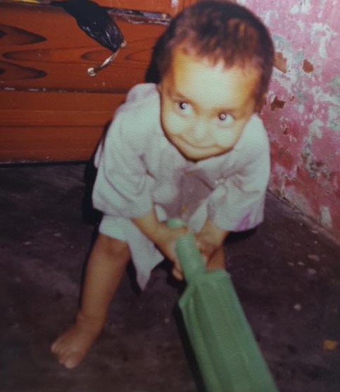 A childhood picture of Faheem Ashraf with a bat