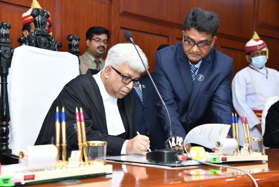 A photo of Subhasis Talapatra taken while he was signing a document after his swearing-in ceremony as a judge of the Orissa High Court