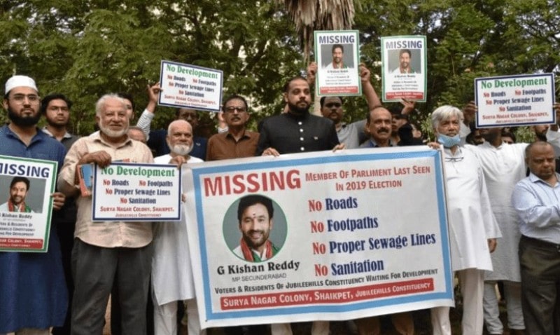 A photo of the residents of the Secunderabad constituency holding a missing banner