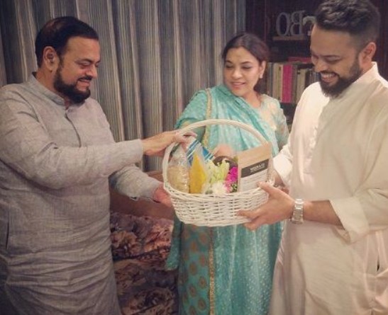 Abu Azmi (left) with his wife and son