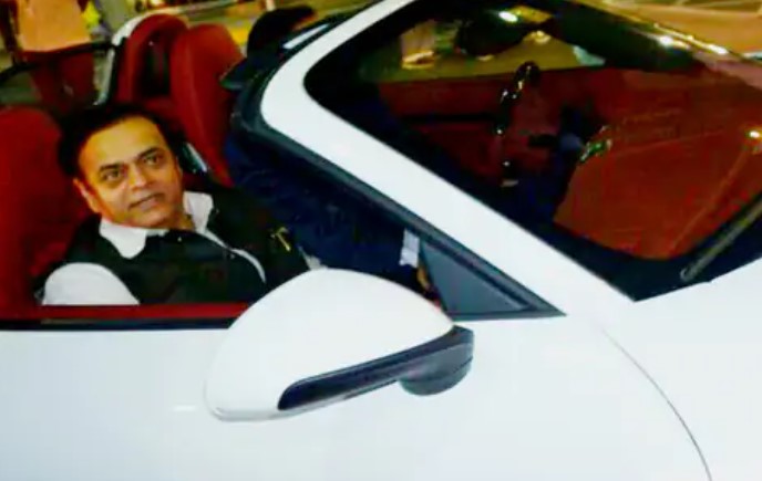 Abu Azmi posing with his car