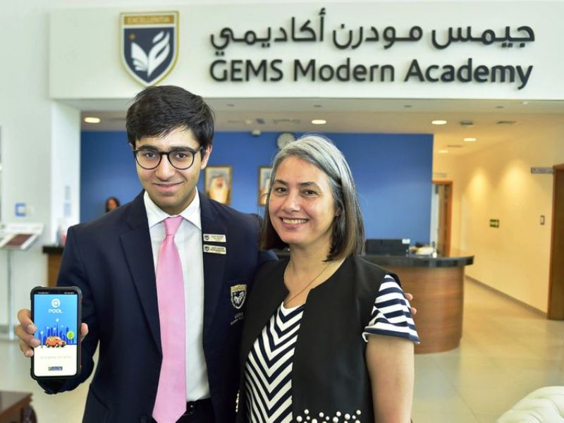 An image of Aadit Palicha when he was a student at Gems Modern Academy introducing his newly launched car pool app to his principal Nargish Khambatta in September 2019