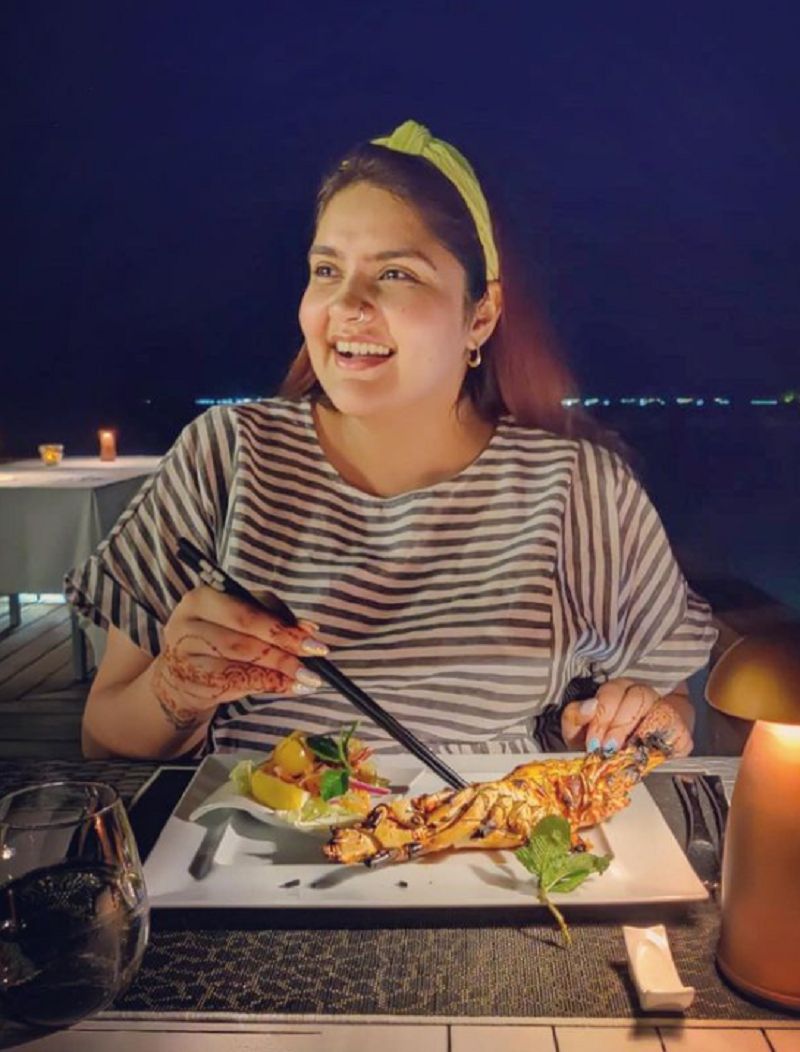 Anjali Anand eating sea food
