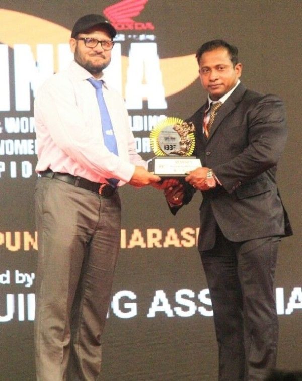 Ashish Sakharkar (right) at a bodybuilding competition as the chief guest