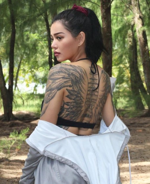 Bella Poarch featuring her back tattoo