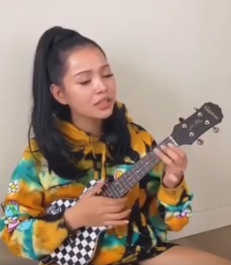 Bella Poarch while playing ukulele