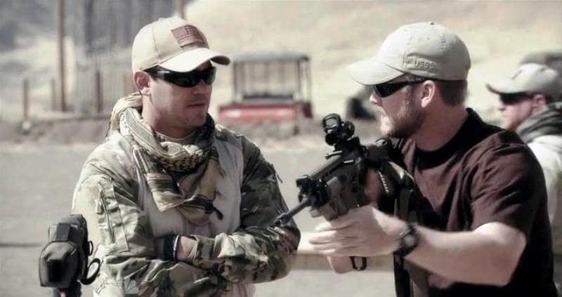 Chris instructing Dean in Stars Earn Stripes on how to handle an assault rifle