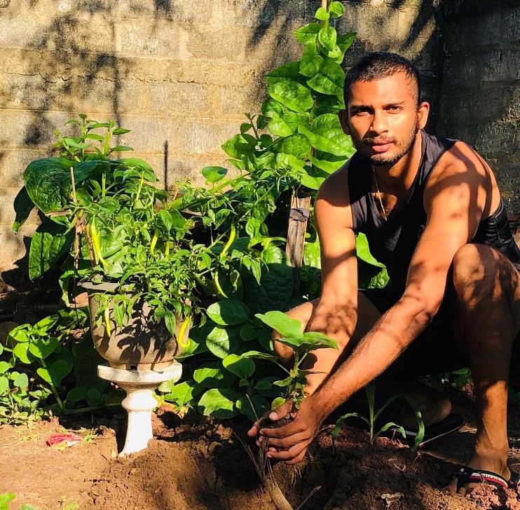 Dasun Shanaka while planting a sapling