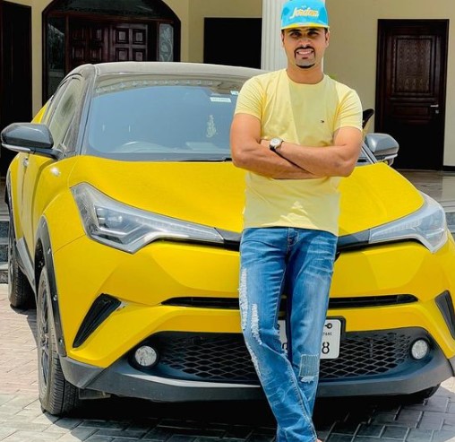 Faheem Ashraf posing with his Toyota CH-R