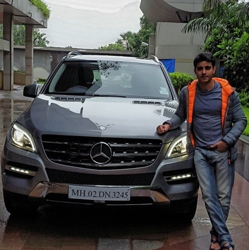 Gautam Rode with his Mercedes
