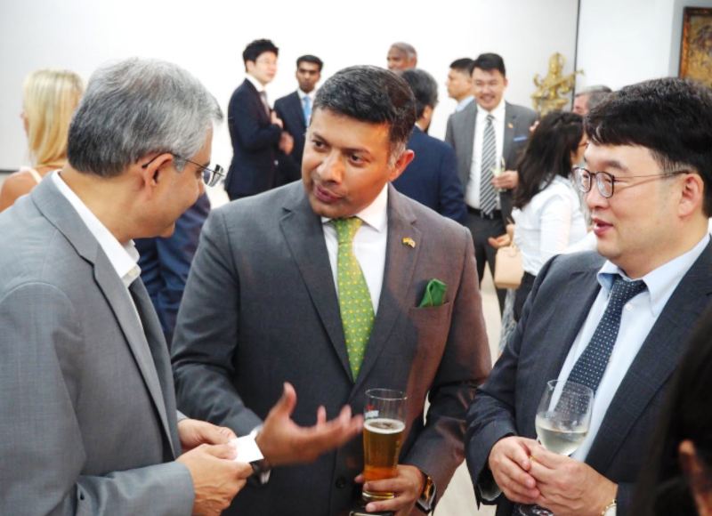 Indian Ambassador to Korea Vikram Doraiswami (center) speaks with guests at his farewell party at the Indian Embassy in Seoul