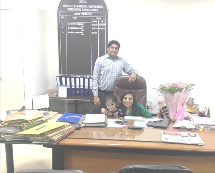 Ira Singhal in her office as Deputy Commissioner of Municipal Council Delhi with her brother and niece