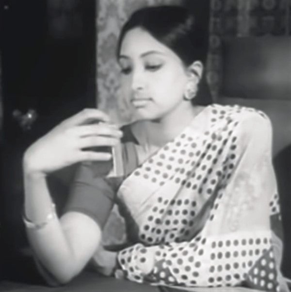 Lakshmi in a still from the film Sila Nerangalil Sila Manithargal