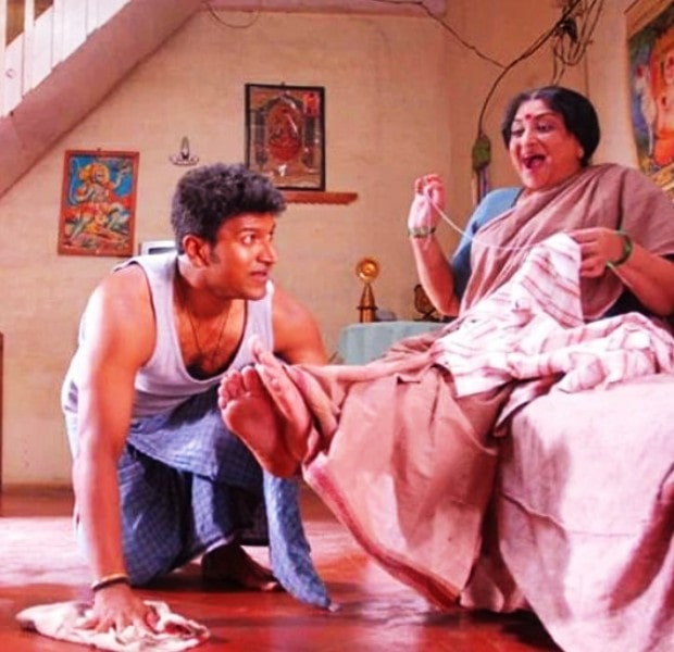 Lakshmi with Puneeth Rajkumar in a still from the film Vamshi