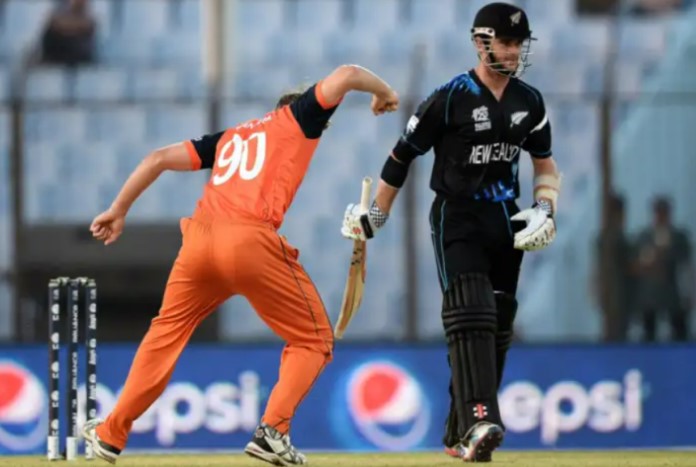 Logan van Beek (in orange) while playing the 2022 ICC Men's T20 World Cup Global Qualifier B tournament