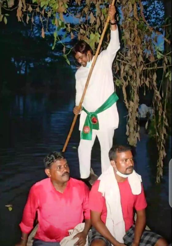 Mukesh Sahani rowing a boat during his early days in politics