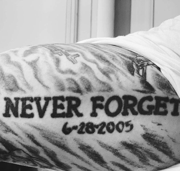 Never Forget and 6-28-2005 tattooed on one of his biceps