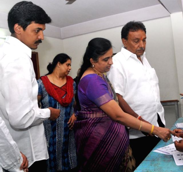 Priya Krishna with his parents casting votes
