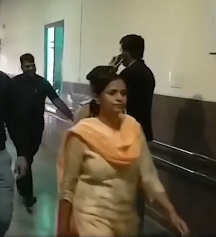 Ranu Sahu (in yellow suit) going to court in ED custody