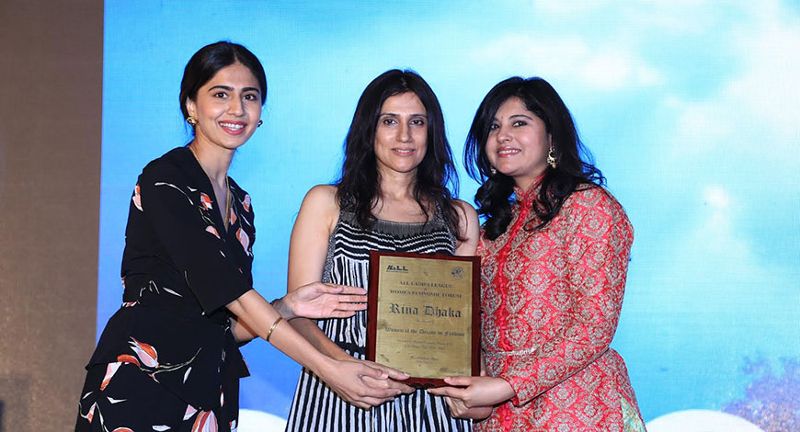 Rina Dhaka recieving an award
