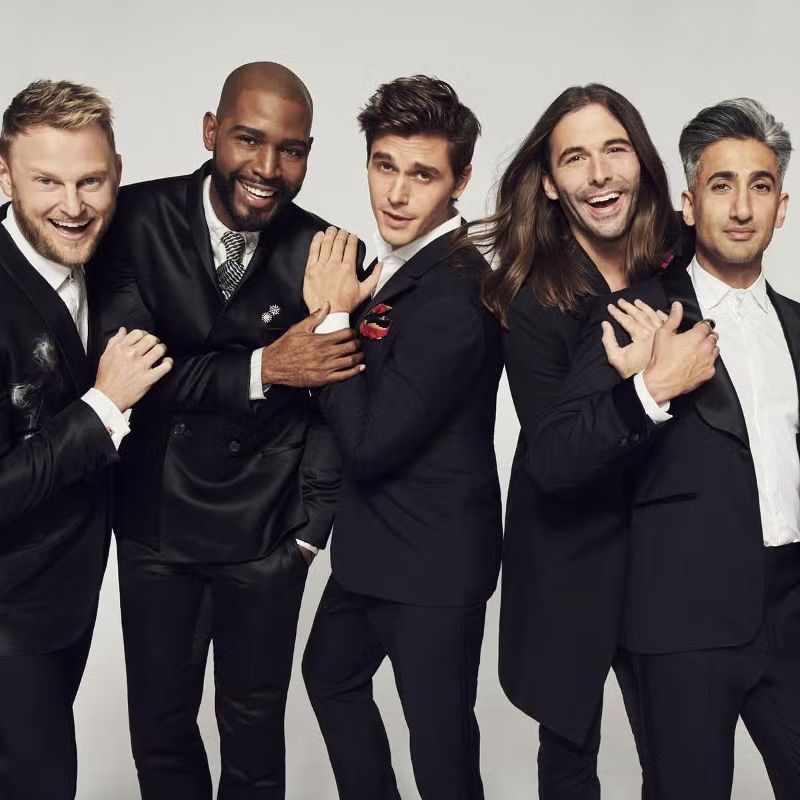 Tan France (right) with the cast of 'Queer Eye'