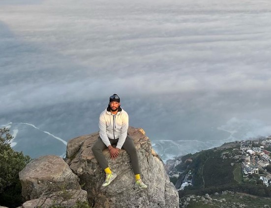 Vikramjit Singh posing at Lions Head Mountain, Capetown