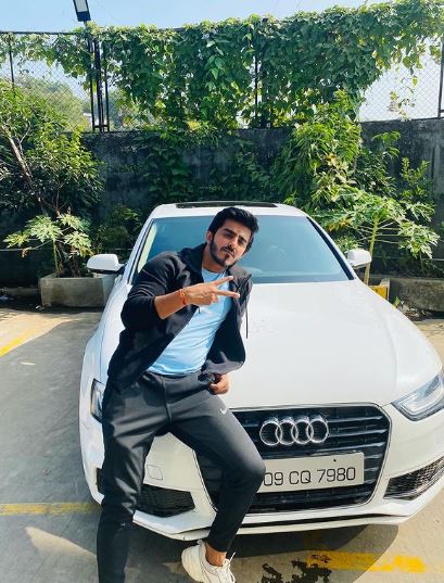Vishal Singh posing with his Audi