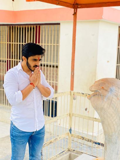 Vishal Singh praying at a temple