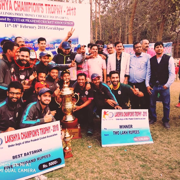 A picture of Akash Vasisht posing with his team after winning Lakshya Champions Trophy in 2018