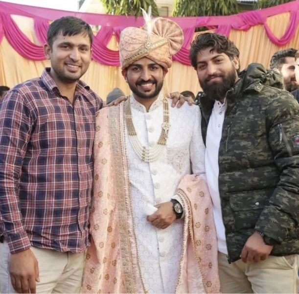 A picture of Karan Sangwan (centre) from his wedding