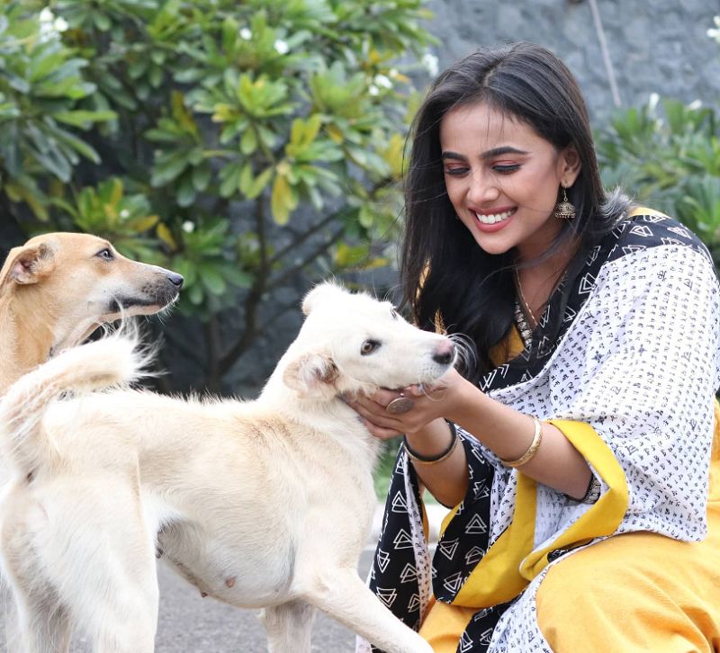 A picture of Sayli Salunkhe with stray dogs