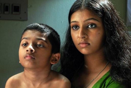 A screengrab from the film Raghuvinte Swantham Raziya, featuring Lakshmi Menon (right)