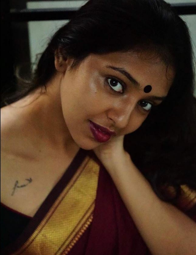 A tattoo below the right collarbone of Lakshmi Menon