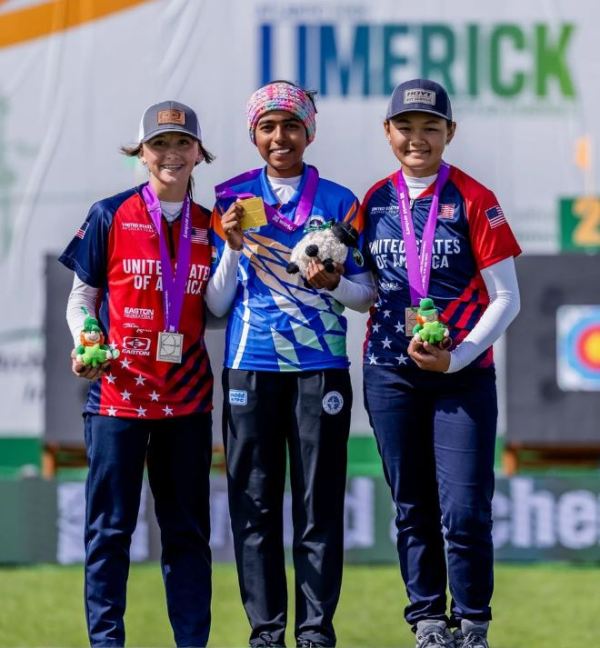 Aditi Swami (centre), along with Leann Drake (left) and Liko Arreola (right), after winning gold at the 2023 World Archery Youth Championships in Limerick, Ireland