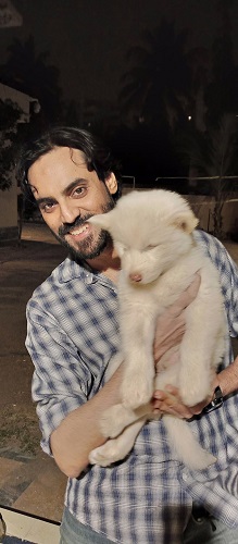 Adnan Hussain and a dog