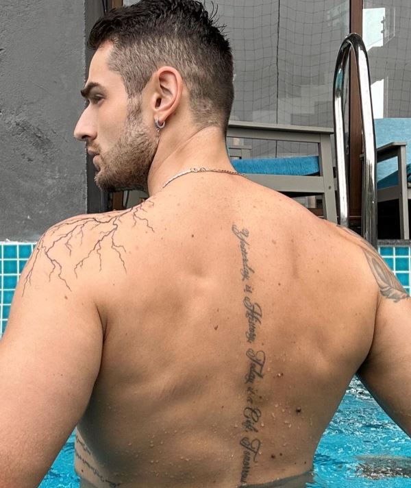 Aleksandar Alex Ilic's veins tattoo on his left shoulder and another tattoo on his spine