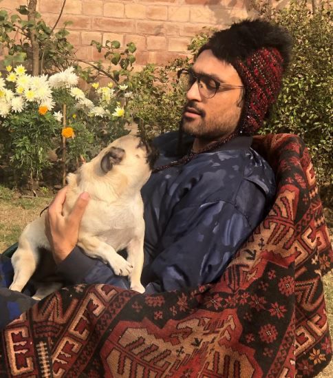 Ali Sethi playing with his dog